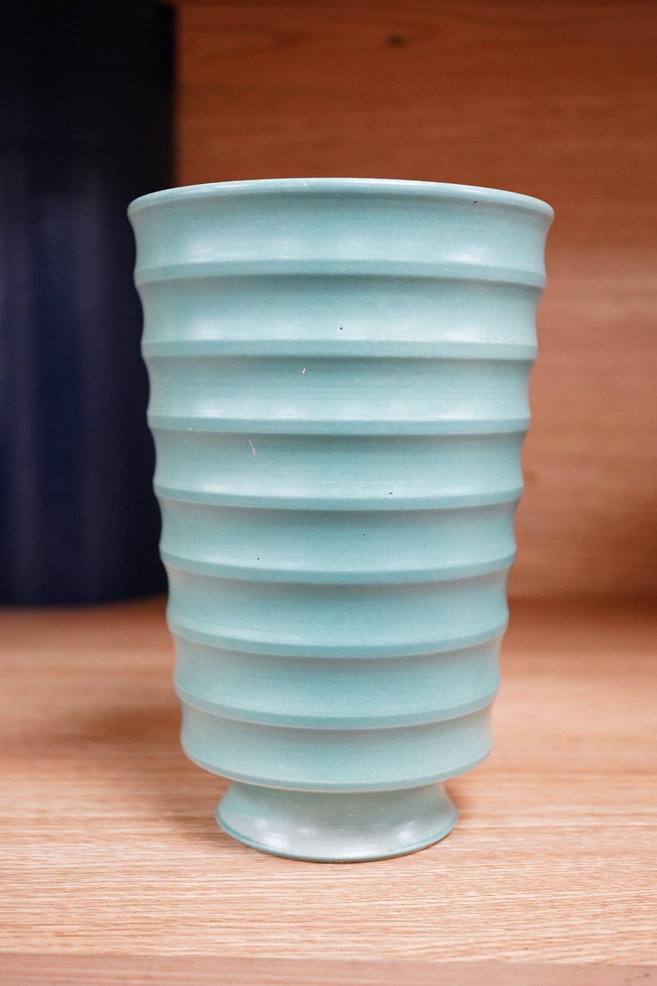 Keith Murray for Wedgwood, a ribbed tapering green glazed vase, 18cm high